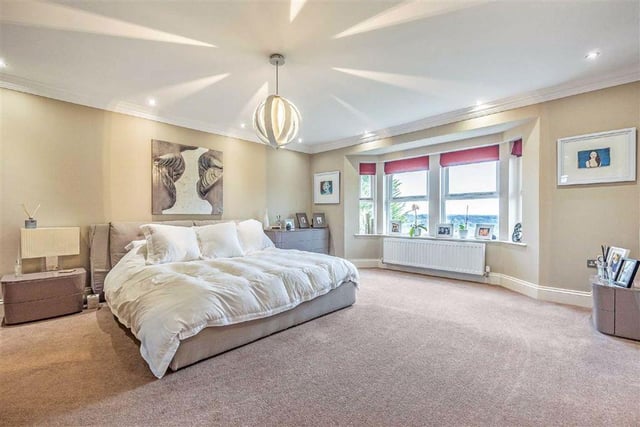There are six bedrooms spread across three floors, including this beautiful master bedroom which benefits from a dressing room and en-suite bathroom.