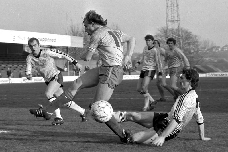 Dave Caldwell is tackled during the visit of Hereford United