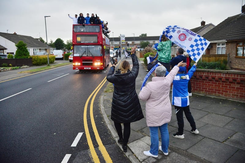 Hartlepool United fans celebrate as the promotion bus tour arrives at the Fens.