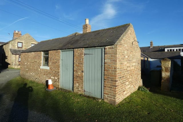The property comes with two outbuildings.