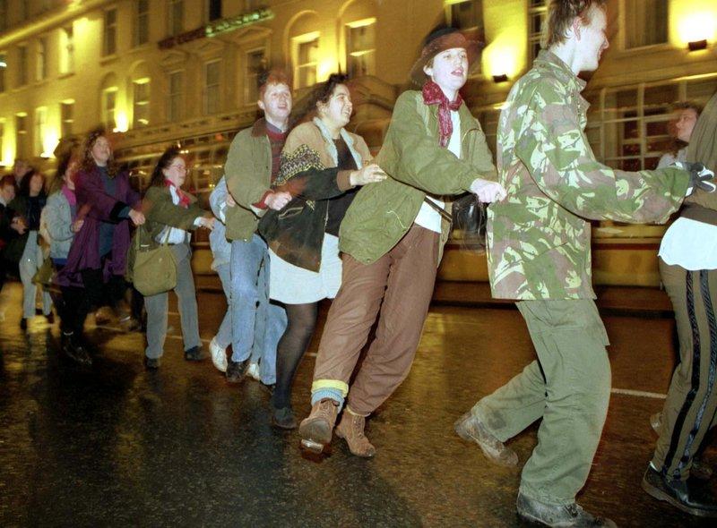 Glaswegians celebrate the end of Glasgow Year of Culture with a street party and conga line in George Square on Hogmanay 1990.