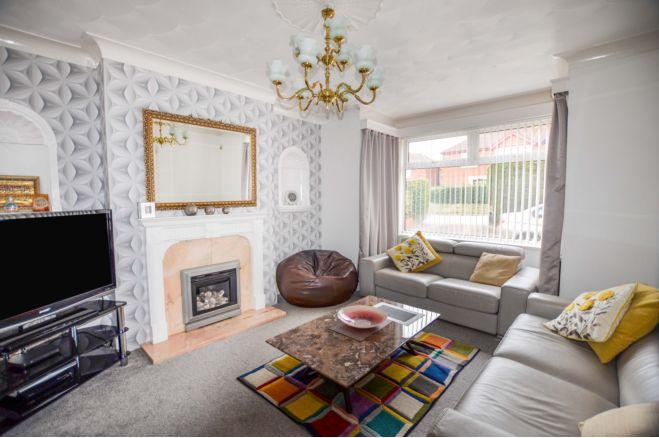 The lounge has a bay window overlooking the front garden and a a feature fireplace housing a gas fire. There are two wall mounted niches and coving to the ceiling.