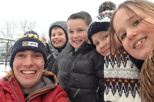 Fun in the snow at  St Edmunds C Of E Primary School, Mansfield Woodhouse. From left - Jack Farinazzo (Teaching Assistant), Oscar Wilson (8), Layton Jones (8), Aucklen Virtue (8) and Betsy Street (7).