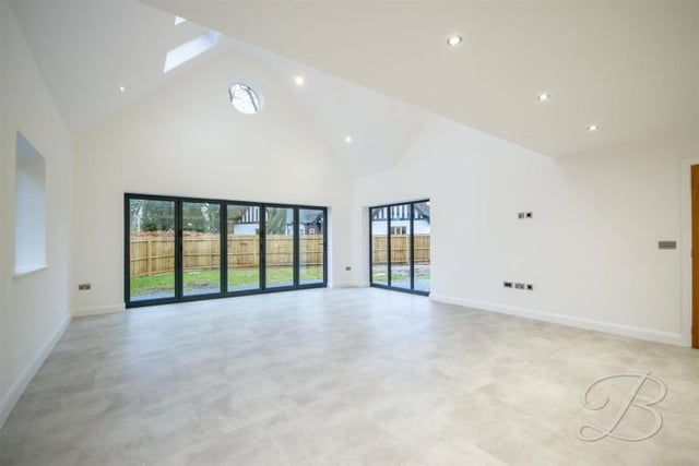 The estate agent's favourite room in the house, boasting a spacious open plan living area with an impressive vaulted high ceilings and bi-fold doors leading on to the rear garden, making this the "perfect space for entertaining".