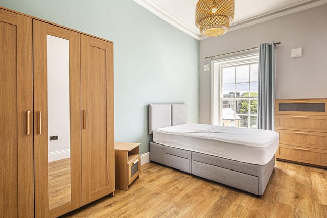 The master bedroom has a dressing room and an en-suite shower room, plus there are two further double bedrooms.