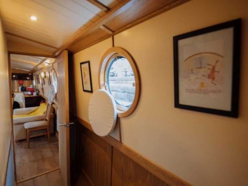 Porthole windows flood the interior with light.
