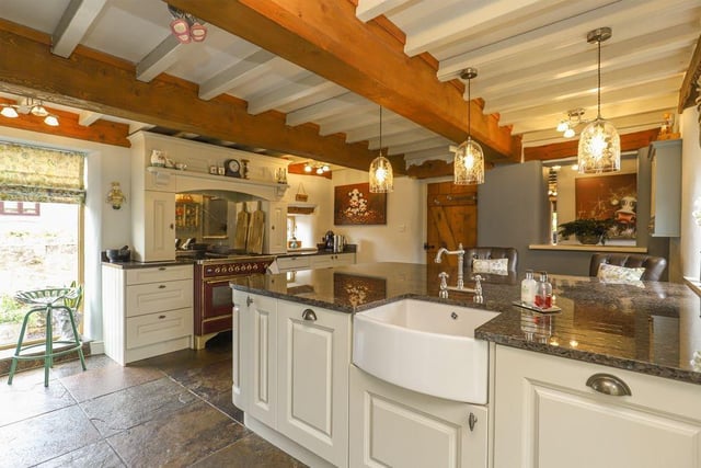 The "fabulous" breakfast kitchen is fully integrated and comes with an island and butlers sink.