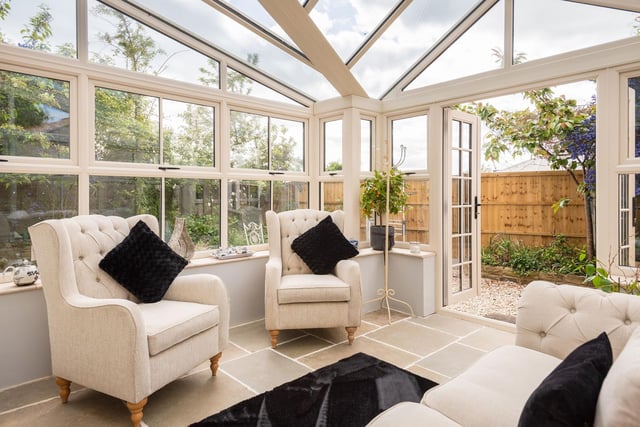 The conservatory is flooded with natural light which combined with the beautiful furnishings give the space an inviting feel.