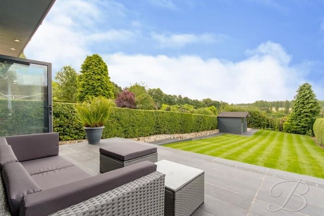 A large black limestone patio will be "great for those summer days" whilst having a BBQ as and when you have any friends or family over.