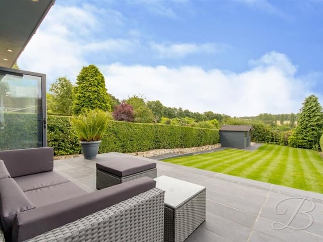 A large black limestone patio will be "great for those summer days" whilst having a BBQ as and when you have any friends or family over.