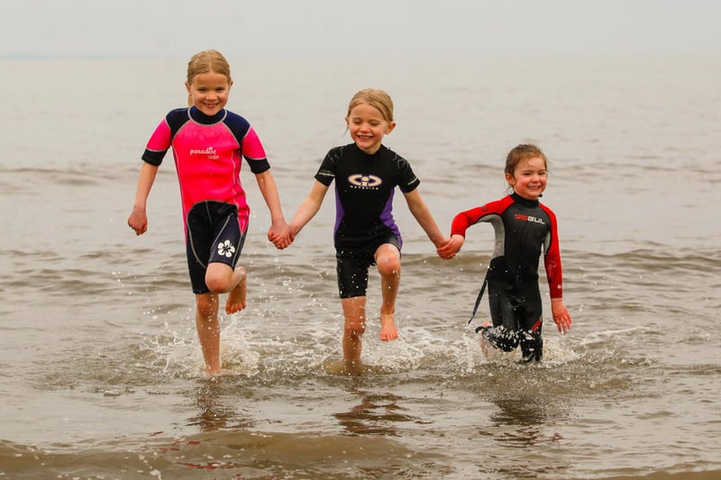 The recent relaxing of restrictions came just in time for the Easter holidays. Pictured here is Lucy, eight, Freya, six, and Tess, four, who enjoyed a swim in the sea on Good Friday.