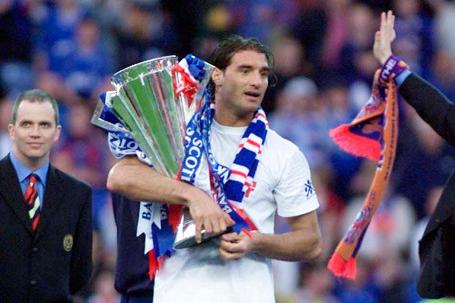 Captain of Dick Advocaat's side, Amoruso lifted the trophy three times as captain of Rangers including here in 2000.