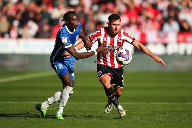 Sheffield United's George Baldock (right) and Birmingham City's Emmanuel Longelo battle for the ball at the weekend: Isaac Parkin/PA Wire.