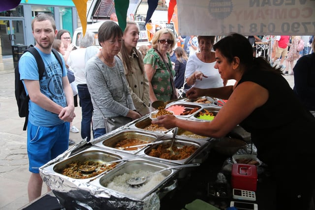 Jas Dhillon of the home kitchen vegan serves up yhe vegitable curry to Chesterfield shoppers in 2019