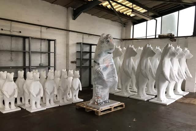 Big and little bears at the warehouse awaiting painting.