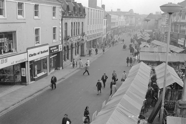 West Gate in 1972, with a bustling market and lots of shoppers
