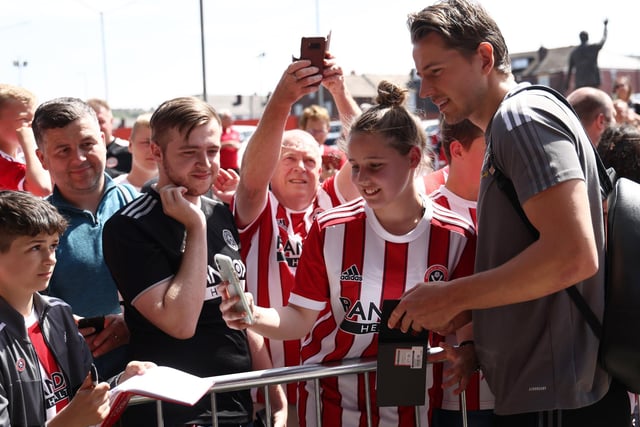 A  fan takes a selfie with Sander Berge of Sheffield Utd before the Sky Bet Championship match at Bramall Lane