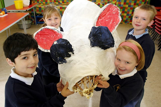 Eyam Primary School pupils Nicole Hoskin, 8, Jake Webster, 8, Darshan Campbell-Bans, 8, and Anna Hill, 6, with the giant plague rat they made for the village Bonfire Night in 2006