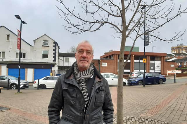 David Lipka next to a tree in Upperthorpe precinct, Sheffield that he says has been replaced several times because of car damage. He wants the area pedestrianised properly. Picture: Julia Armstrong, LDRS