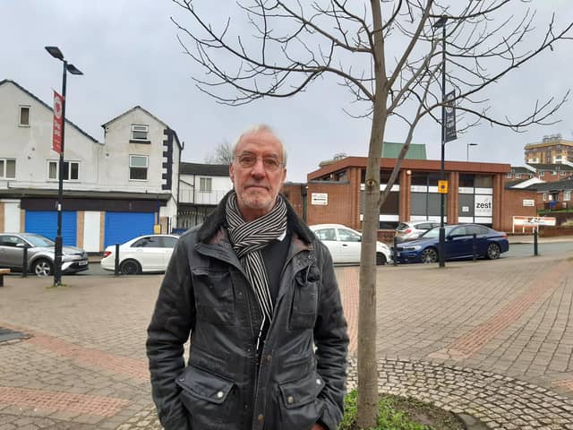 David Lipka next to a tree in Upperthorpe precinct, Sheffield that he says has been replaced several times because of car damage. He wants the area pedestrianised properly. Picture: Julia Armstrong, LDRS