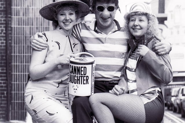 Emlyn Hughes with staff from travel agent Lunn Poly get into the red nose spirit in 1989