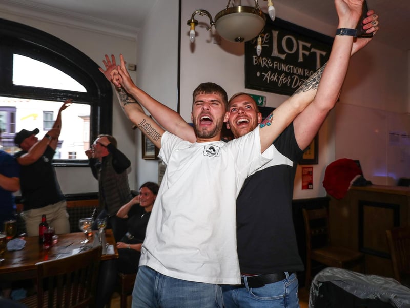 Fans pictured in The Kings pub celebrating on the final whistle. Picture: Stuart Martin (220421-7042)