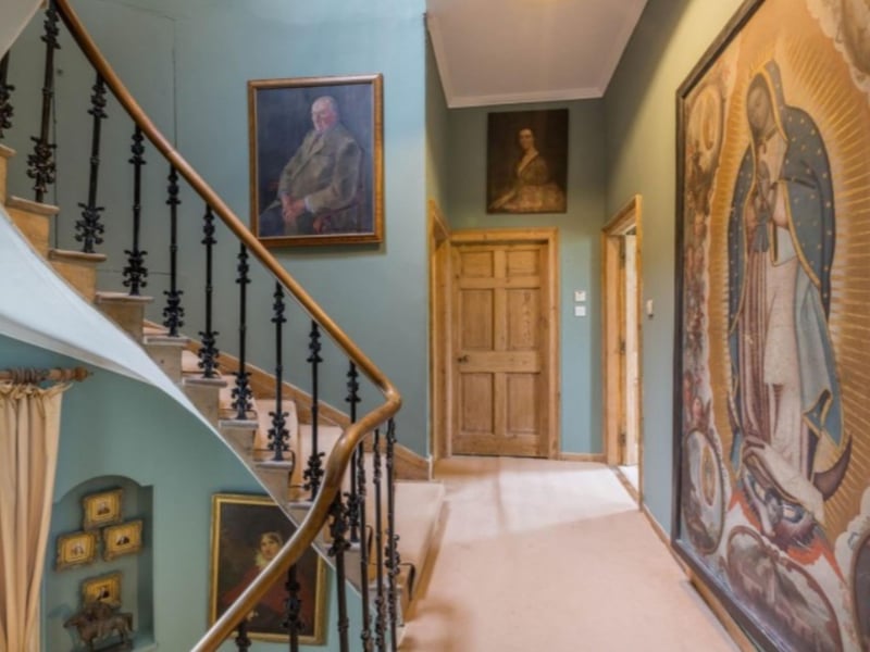 The walls are lined with an impressive collection of original art.