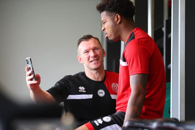 Sheffield United's Rhian Brewster with backroom staff member Paul Evans at the club's training ground this week: Simon Bellis / Sportimage