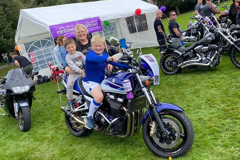 Youngsters enjoying a go on this powerful motorbike. Mum looks keen to try it out too!