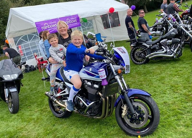 Youngsters enjoying a go on this powerful motorbike. Mum looks keen to try it out too!