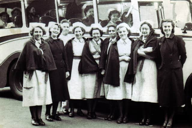 Night staff coming off duty at the Royal Infirmary, Sheffield, in 1951, next to a bus taking them up to Graham Road. Picture courtesy of M Bramley, Hope Valley