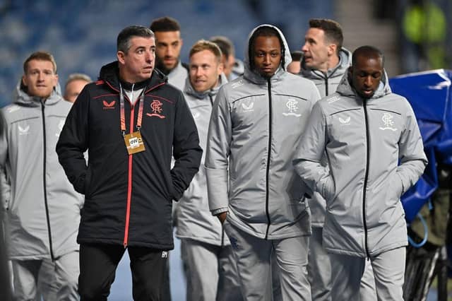 Rangers players walk around the pitch ahead of the UEFA Europa League Group A football match between Rangers and Sparta Prague. (Photo by PAUL ELLIS/POOL/AFP via Getty Images)