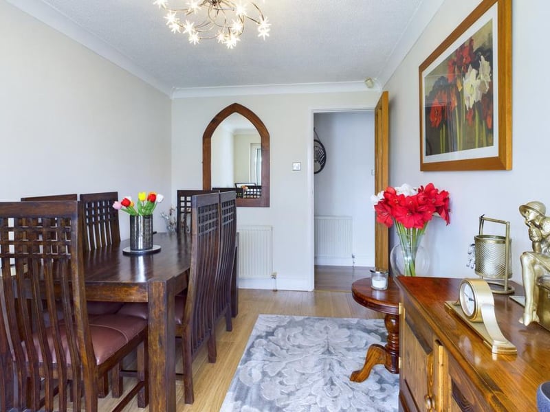 Dining room - uPVC double glazed sliding patio door opening into the conservatory, ceiling coving, wood effect laminate flooring, radiator panel and power points.