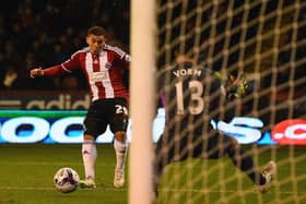 Che Adams scores his first goal against Spurs in the 2015 League Cup semi-final  (Photo by Laurence Griffiths/Getty Images)