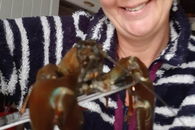Suzanne and her new crayfish friend.