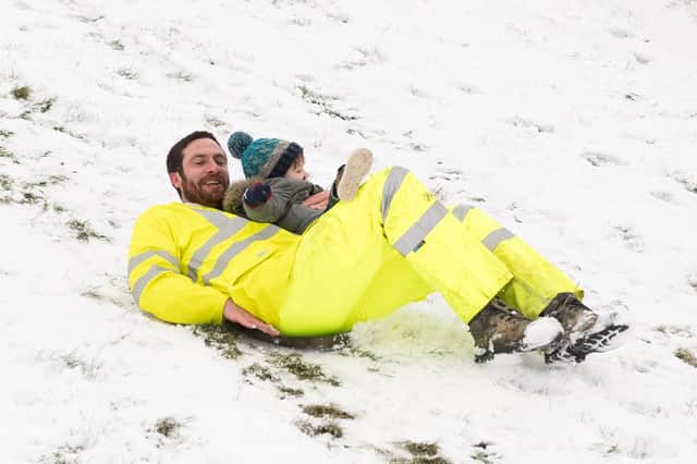 Jake and Maverick Gofton enjoy the snow in Southsea in March 2018. Picture: Keith Woodland