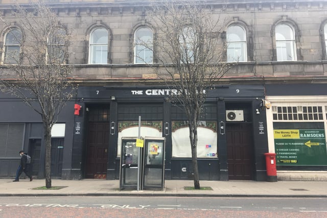 Masked person pictured walking past The Central Bar, Leith Walk, Edinburgh, which is currently closed with blinds firmly down during the coronavirus outbreak