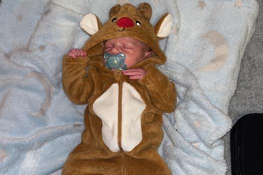 Little Jude in a reindeer onsie. Submitted by Bronwyn Kathleen Brodie.