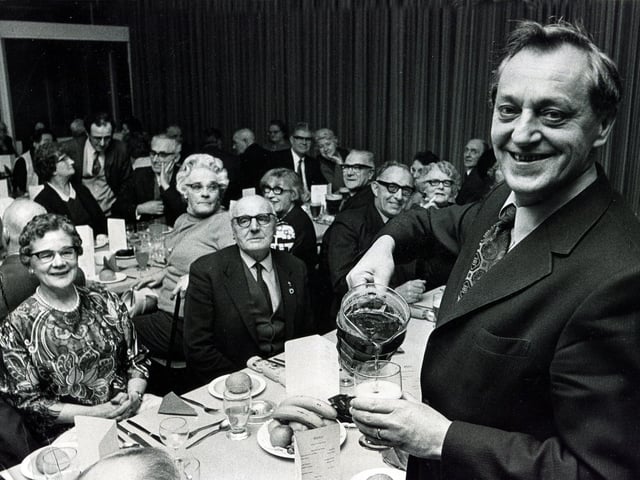 Tinsley Wire Industries retired persons annual Christmas dinner. Mr James Fouldes, the group general manager and director, takes a job as waiter at the dinner in December 1973