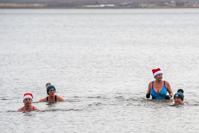Swimmers from Wild Swim Scotland in their element as they join the annual festive tradition with others on Christmas day.