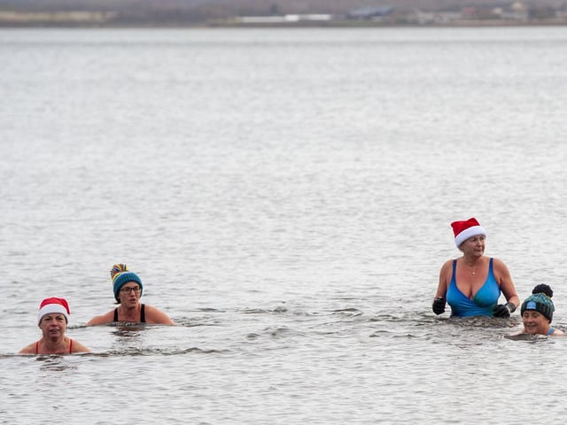 Swimmers from Wild Swim Scotland in their element as they join the annual festive tradition with others on Christmas day.