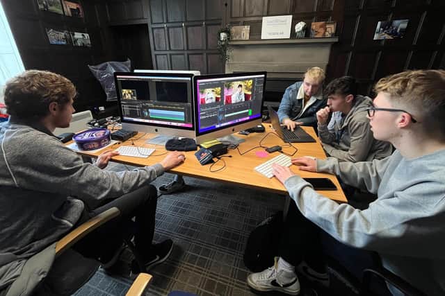 Dan Shipway, of Sheffield, Ed Jones from Doncaster and Loui Goodinson from Rotherham with guest trainer Connor Alderson.. They are all working on editing films using Adobe Premier Pro software.