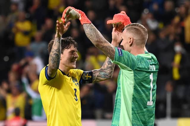 Sweden's goalkeeper Robin Olsen (R) and Sweden's defender Victor Lindelof (L)react after their 2-1 win iover Spain (Photo by JONATHAN NACKSTRAND/AFP via Getty Images)