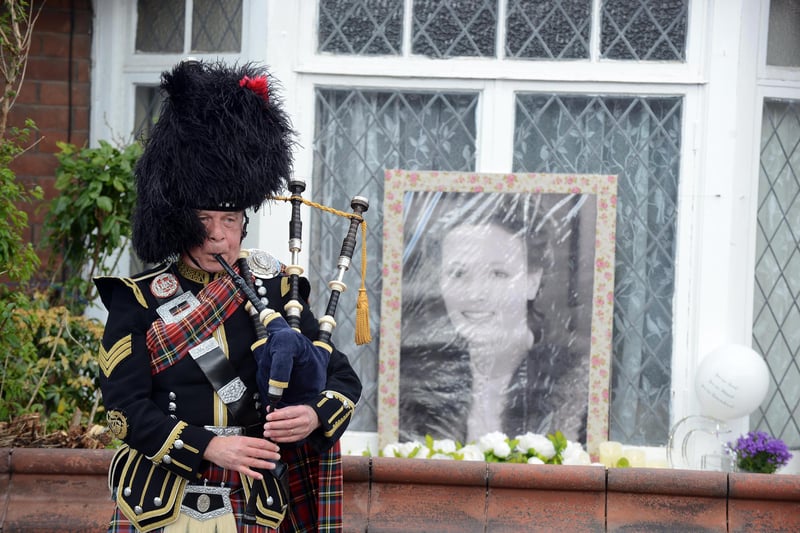Bag piper at the funeral procession for Monkton Village store Gladys Stonehouse.
