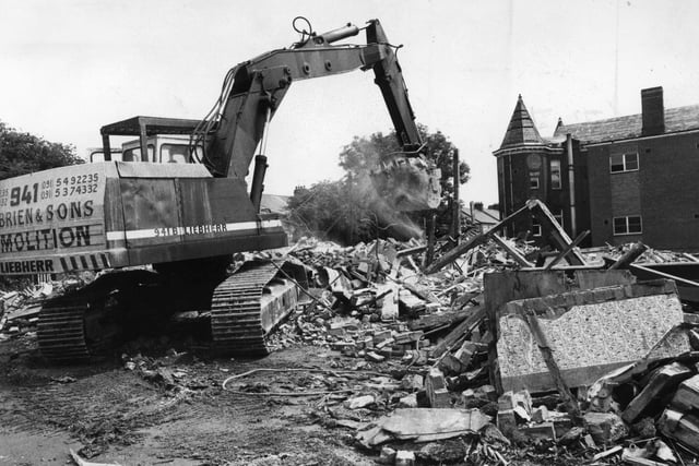 Back to June 1991 and a digger clears bricks and mortar away from the Ingham Infirmary which was to make way for housing.
