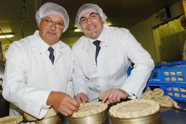 Roger Topping and Mayor Martin Winter put the finishing touches to one of Topping's Pie Company's famous pies, after officially opening the factory in 2007