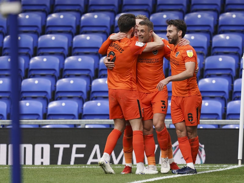 Lee Brown celebrates his first goal with his team-mates.
