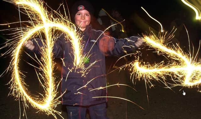 Jordan Cardow, aged nine enjoying sprinklers in 2003.
