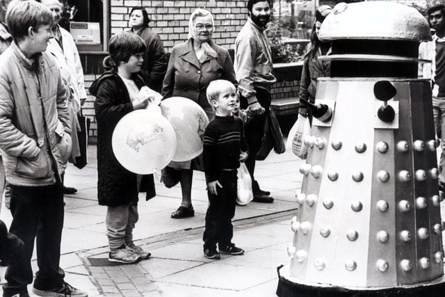 Children are surprised to find a Dalek on The Moor, Sheffield in October 1985