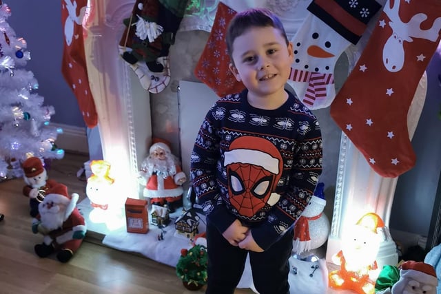 Kian, age 5, shows his super Christmas jumper.